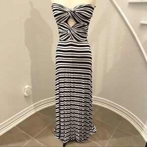 Like new Felicity & Coco asymmetrical strapless dress with peek-a-boo twist. S